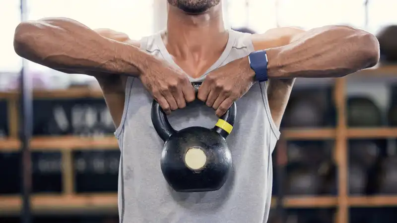 Kettlebell upright rows 50 times daily for one week